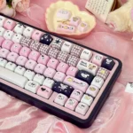 Explore the premium Mikko PBT Keycaps set, highlighting its durable 5-sided dye-sub legends and playful black, white and pink aesthetic from multiple angles.