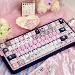 Premium Mikko PBT Keycaps Set. Durable PBT, vibrant 5-sided dye-sub legends in playful black, white and pink. Cherry & FOA profile keycaps from various angles.