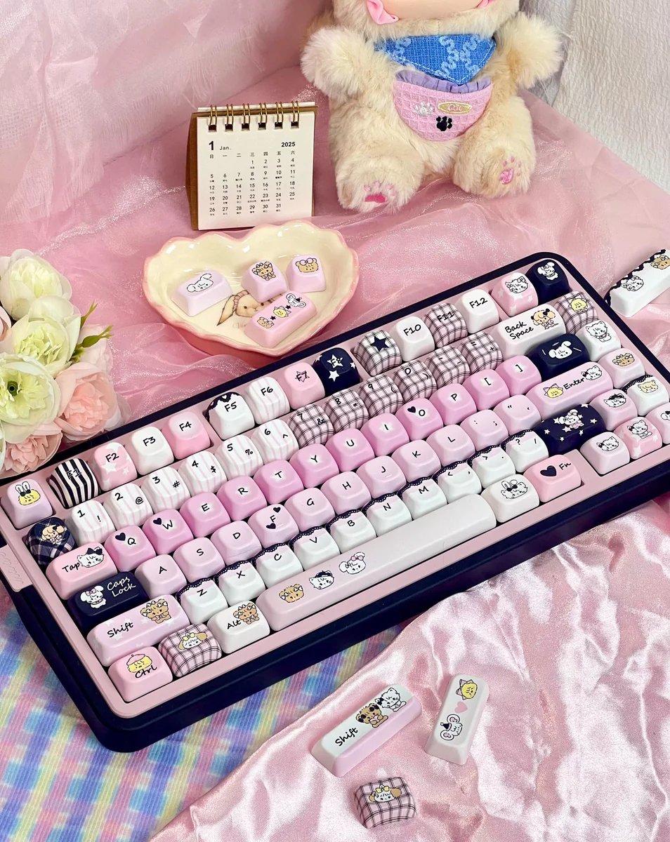 Premium Mikko PBT Keycaps Set. Durable PBT, vibrant 5-sided dye-sub legends in playful black, white and pink. Cherry & FOA profile keycaps from various angles.