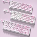 Gallery of durable PBT Miku Nakano shine-through keycaps set from multiple angles, showcasing their vibrant anime theme and playful side-printed legends.