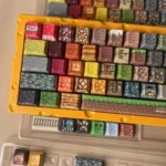 A vivid close-up of the authentic Minecraft pixel art keycaps set, featuring beloved game characters and blocks in Cherry profile, perfect for playful gaming setup.
