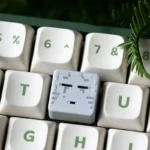 Close-up of a vibrant, handcrafted Minecraft Artisan ESC Keycap, highlighting its detailed pixelated resin art and iconic game design from a striking design.