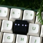 Playful Minecraft Artisan ESC keycap, handcrafted from vibrant pixelated resin, showcasing its iconic game-inspired artistry from a distinct angle.