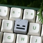 Detailed views of the handcrafted Minecraft Artisan ESC keycap, showcasing its vibrant pixelated resin art and iconic game design from various angles.