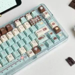 Premium Mint Chocolate PBT Dye-Sub Keycaps Set. Inviting mint green and warm chocolate brown evoke a sweet, comforting aesthetic.
