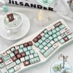 Premium Mint Chocolate PBT dye-sub keycaps set shown from various angles, highlighting sweet mint green and warm chocolate brown.