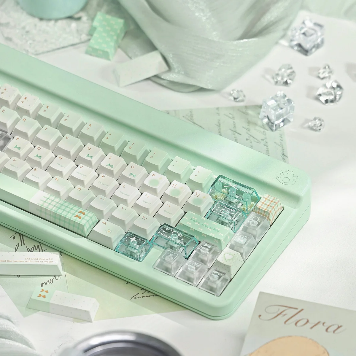 Close-up and wide shots of the ethereal Misty Mint PBT+PC translucent keycaps set, capturing their refreshing hue and serene, misty quality.