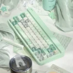 Misty Mint PBT+PC translucent keycaps set displayed from various artistic angles, capturing their ethereal glow, refreshing coastal freshness.