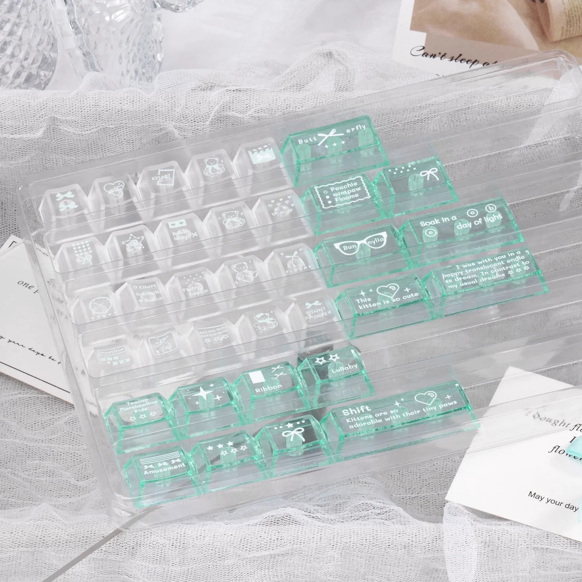 Misty Mint PBT+PC translucent keycaps set from various angles. Ethereal, mist-like finish evokes serene coastal freshness.