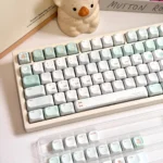 Misty Mint PBT+PC translucent keycaps set from multiple angles, highlighting their serene, ethereal mist-like quality and refreshing coastal aesthetic.