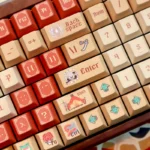 Immersive Monster Hunter Wilds PBT Dye-Sub keycaps set, featuring untamed wilderness and creature-inspired designs displayed from diverse angles for a premium design.