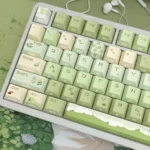 Serene Mountain Stream side-lit PBT keycap set showcasing luminous, side-engraved legends on durable PBT, capturing the tranquil artistry.