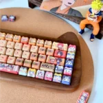 Naruto Keycaps PBT dye-sub set showcasing vibrant anime designs of iconic characters and ninja motifs from a dynamic angle. Unleash your inner ninja motifs.