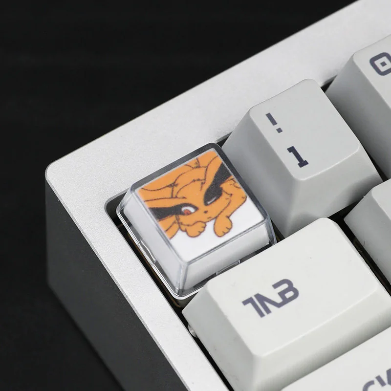 A close-up view of the serene Naruto and Kurama handcrafted resin keycap set, showcasing its vibrant details and artistic craftsmanship from a unique design.