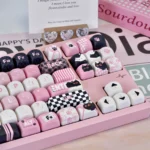 Multiple angles of the mischievous Naughty Cat PBT artisan keycap set, highlighting its vibrant, dye-sublimated design and smooth MOA profile on a mechanical keyboard.
