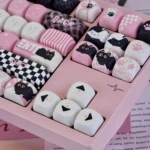 Naughty Cat PBT artisan keycap set for mechanical keyboards. Close-up views show its vibrant dye-sublimated mischievous design and smooth MOA profile.