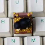 Handcrafted Niffler artisan keycap, intricate sculpting shown from a unique angle. Highlights rich dark tones and whimsical fantasy details for mechanical keyboard.