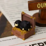 Detailed view of the handcrafted Niffler artisan keycap, highlighting intricate sculpting and whimsical dark fantasy resin artistry from a side perspective view.