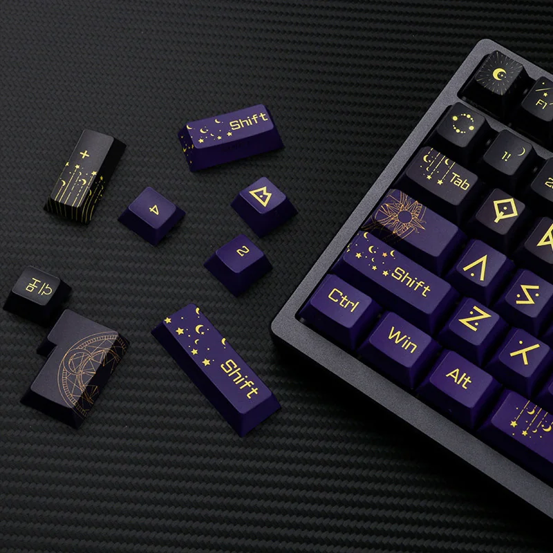 Close-up of translucent PBT Night Sky keycaps set, showcasing the ethereal side-engraved legends glowing like distant stars against a cosmic backdrop.