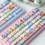 Close-up views of vibrant, adorable Chibi Overwatch Hero Keycaps set, showcasing each collectible character from multiple angles, perfect for gamers.