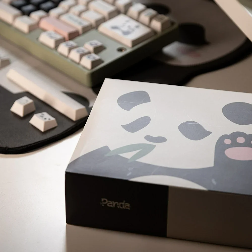 Artistic close-up of Panda PBT keycaps set, showcasing the durable PBT material, crisp dye-sub legends, and charming panda design.