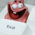 Handcrafted Patrick Star resin keycap, showcasing its vibrant details and nostalgic SpongeBob charm from a playful, unique perspective.