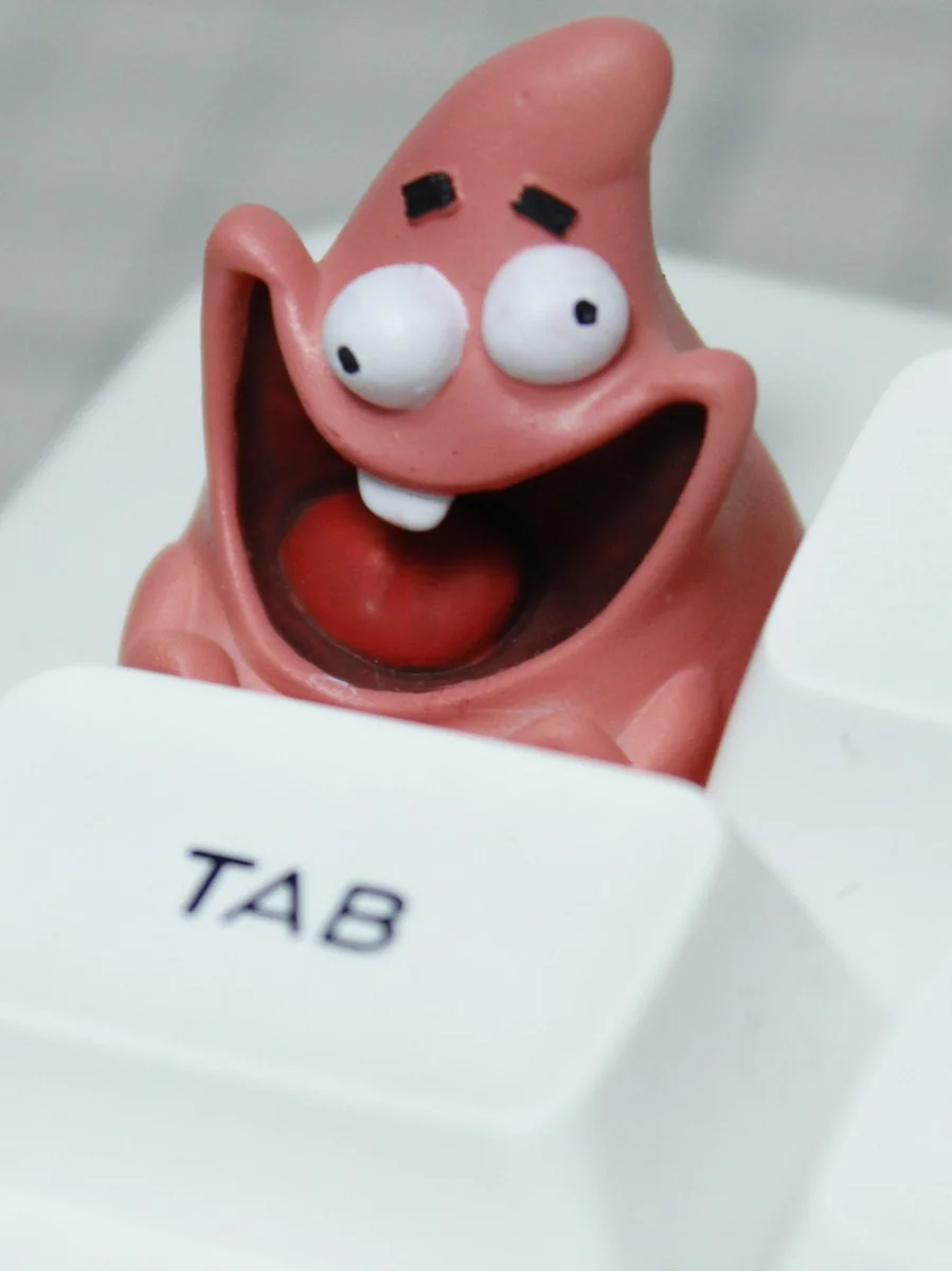 Handcrafted Patrick Star resin keycap, showcasing its vibrant details and nostalgic SpongeBob charm from a playful, unique perspective.