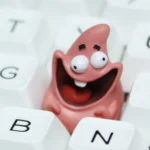 Handcrafted Patrick Star resin keycap from a unique angle, highlighting vibrant details and playful, nostalgic expression for a custom keyboard.