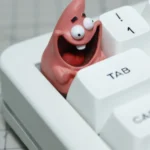Different angles of a handcrafted Patrick Star resin keycap, highlighting its vibrant details and playful, nostalgic SpongeBob design.