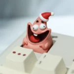 Vibrant, handcrafted Patrick Star Christmas keycap featuring a playful smiling expression, a nostalgic resin novelty for your keyboard.
