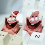 Vibrant handcrafted Patrick Star resin keycap, capturing his iconic expression, a nostalgic novelty for keyboard enthusiasts.