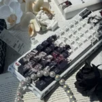 Elegance PBT black-white keycaps set in a detailed shot, highlighting durable PBT and crisp five-sided dye-sublimation with classic, mystical design.
