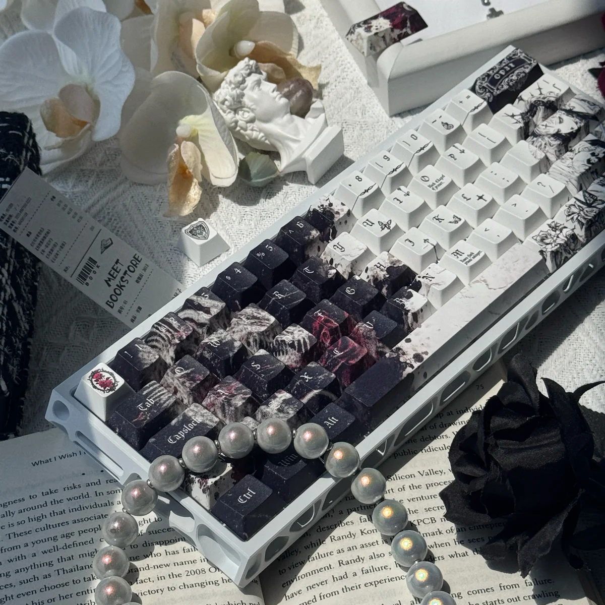 Elegance PBT black-white keycaps set in a detailed shot, highlighting durable PBT and crisp five-sided dye-sublimation with classic, mystical design.