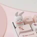 A collection of whimsical Pet Cafe ESC keycaps, presented from various angles, featuring adorable artisan rabbit, cat, and Shiba Inu characters in charming setup.