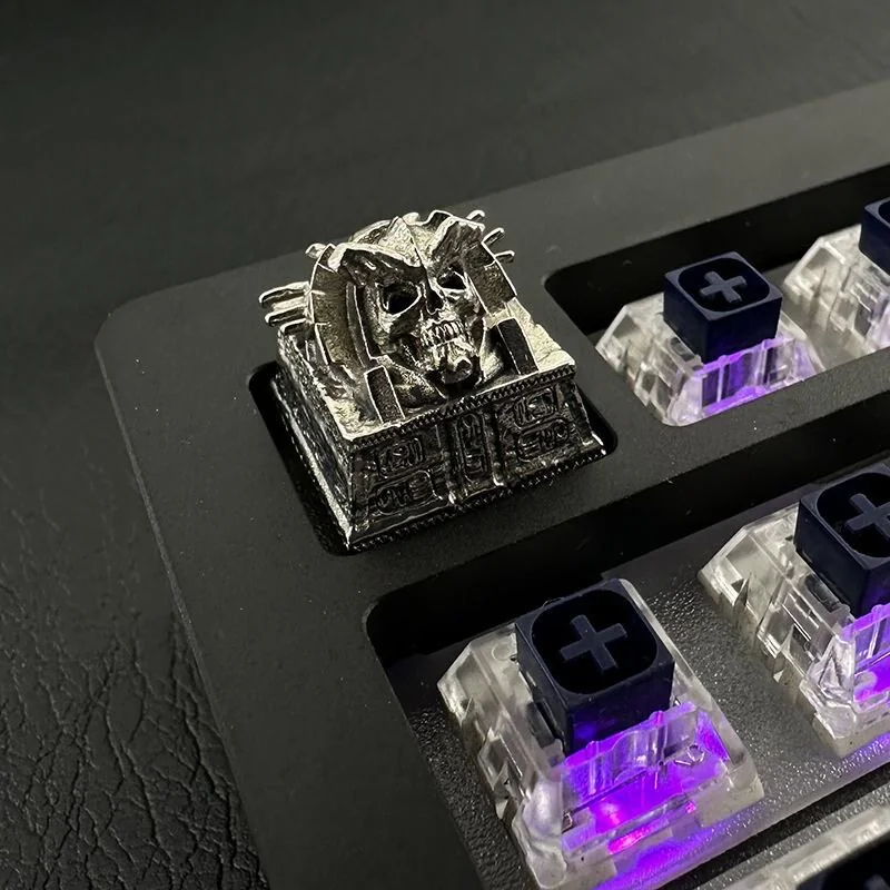 Detailed shot of the handcrafted skull keycap, showcasing its rugged texture and ancient Egyptian Pharaoh Punk design from a unique angle.