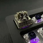 Detailed view of the handcrafted Artisan Skull Keycap, showcasing its ancient Egyptian pharaoh punk design and dark metallic finish, a unique design.