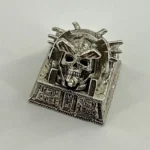 Various perspectives of the artisan skull keycap, emphasizing its handcrafted metallic construction, ancient Egyptian Pharaoh design, and dark punk setup.