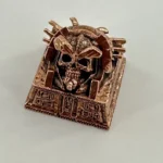 Artisan handcrafted copper skull keycap, embodying Pharaoh Punk mystique with ancient Egyptian dark punk detailing for a unique desktop.