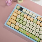 Adorable Pig Pilot PBT MOA keycap set from various angles, featuring playful pig pilot designs and aviation motifs for a fun, unique keyboard look.
