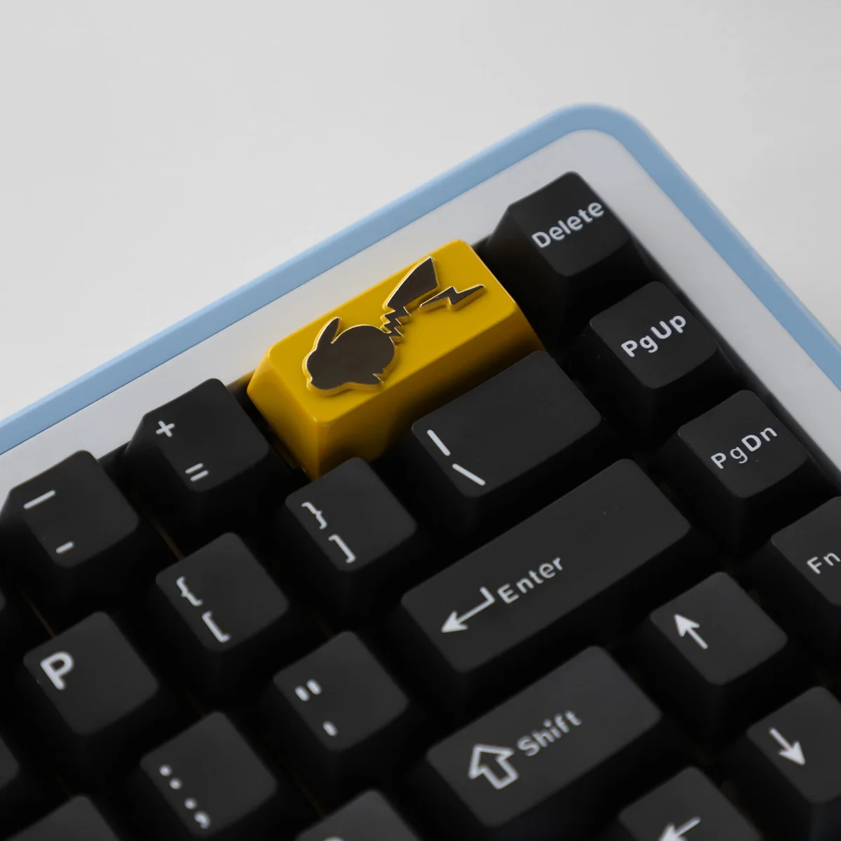 Premium zinc alloy Pikachu backspace keycap, showcasing vibrant, detailed craftsmanship for nostalgic keyboard enthusiasts. A collectible art piece.