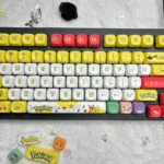 Vibrant yellow Pikachu MOA profile keycaps set displayed from multiple playful angles, showcasing the full set's electric charm for custom keyboards.