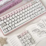 Dazed Cat Keycap Set: adorable pastel Dazed Cat designs from multiple angles, highlighting versatile backlit options for whimsical keyboard personality design.
