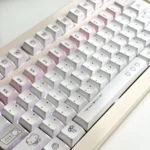 Charming Dazed Cat Keycap Set in pastel hues, seen from various angles, emphasizing adorable design and versatile backlit options for whimsical keyboard.