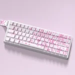 Close-up of vibrant Miku Nakano PBT side-lit keycaps set from various angles, showcasing crisp legends and playful art for anime design.