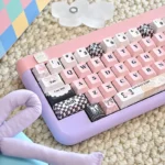 Adorable Sweetheart Pink PBT keycaps set, showcasing playful dye-sub legends and charming pastel pink hues from various angles. Perfect for custom keyboard.