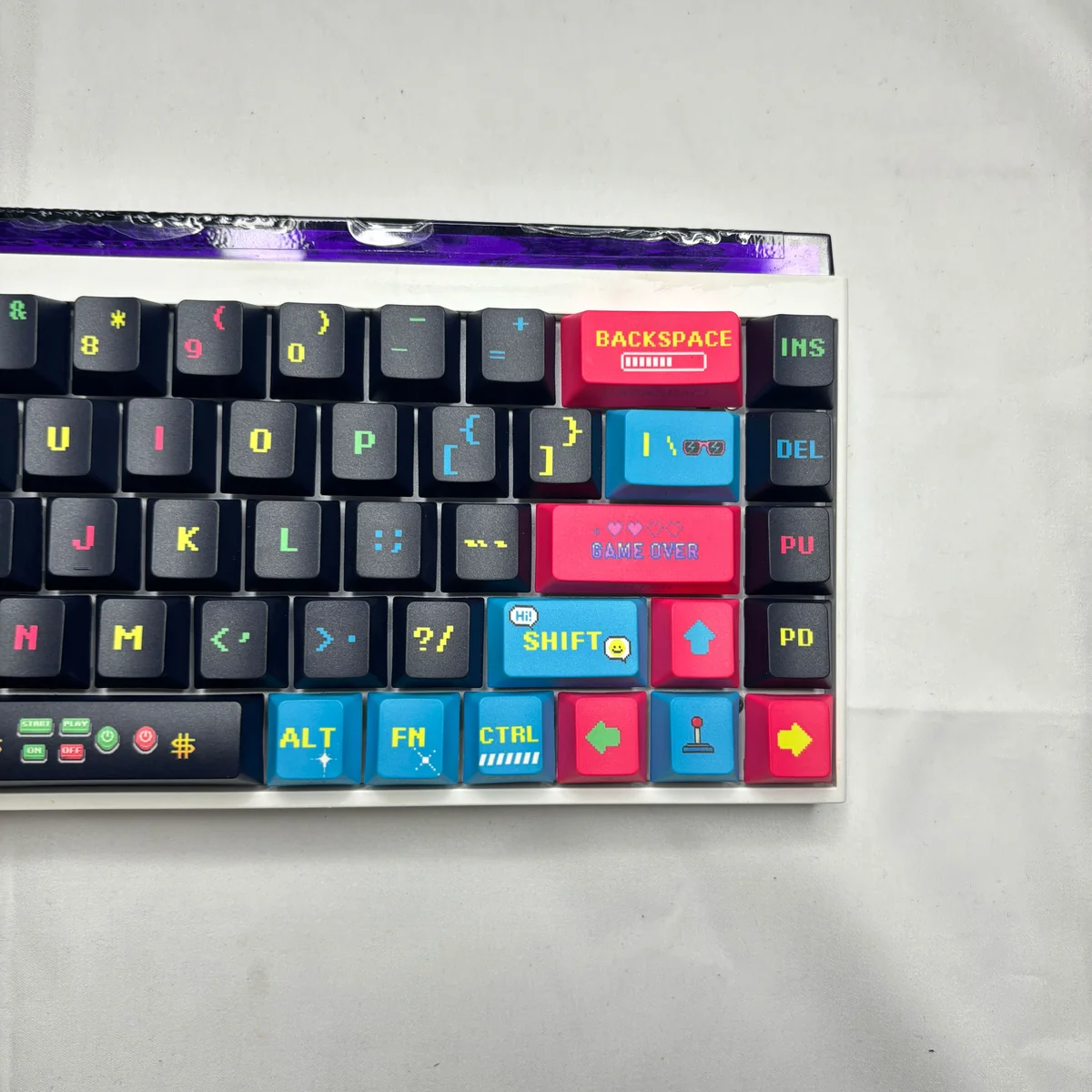 Vibrant retro arcade Pixel Video Games Keycaps set, showcasing playful pixel art and dynamic side-lit translucent PBT from multiple engaging angles.