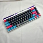 Detailed gallery views of vibrant Pixel Video Games keycaps set, highlighting their retro arcade design and dynamic side-lit translucent PBT legends from multiple angle.
