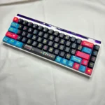 A playful 74-key set of Pixel Video Games Keycaps featuring vibrant retro arcade pixel art and dynamic side-lit translucent PBT, perfect for custom keyboards.