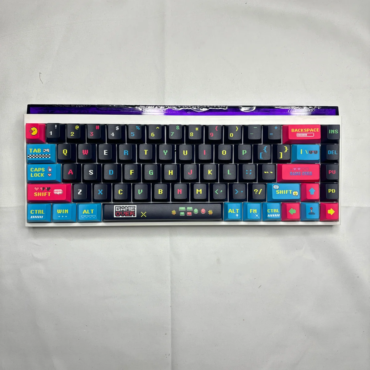 Vibrant pixel video games keycaps set, showcasing a retro arcade PBT side-lit set with dynamic translucent legends for a playful keyboard.