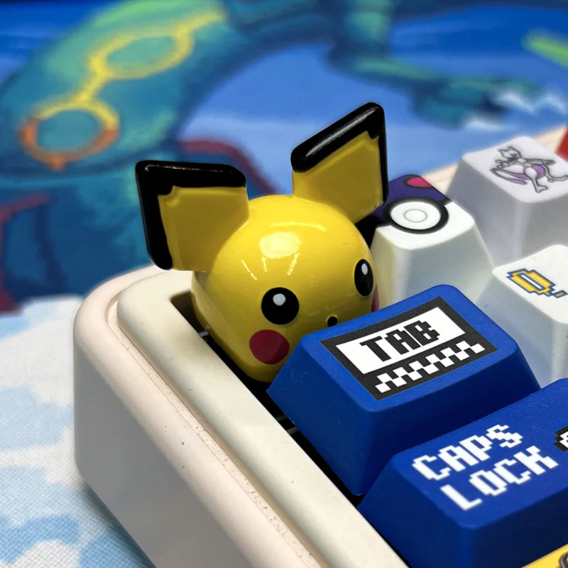 Vibrant, handcrafted Artisan Pokemon Resin Keycap featuring a detailed miniature Pokemon, perfect nostalgic keyboard art for collectors.